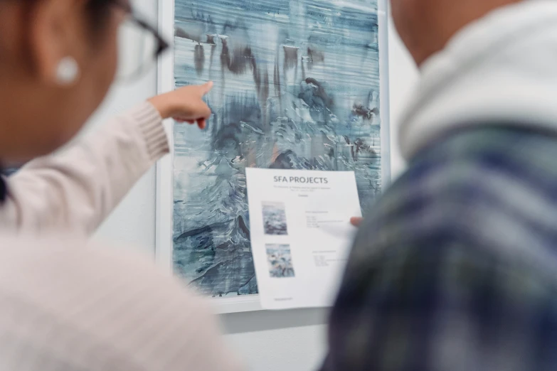 a couple of people standing in front of a poster, a poster, by Emma Andijewska, unsplash contest winner, visual art, blue print, slightly blurred, information visualization, 4k)