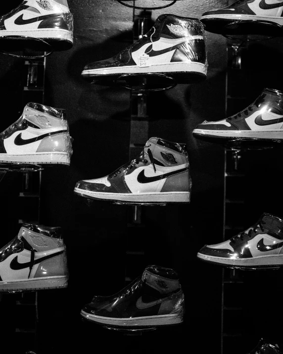 a black and white photo of a display of sneakers, inspired by Jordan Grimmer, pexels, “air jordan 1, highly polished, thumbnail, 15081959 21121991 01012000 4k