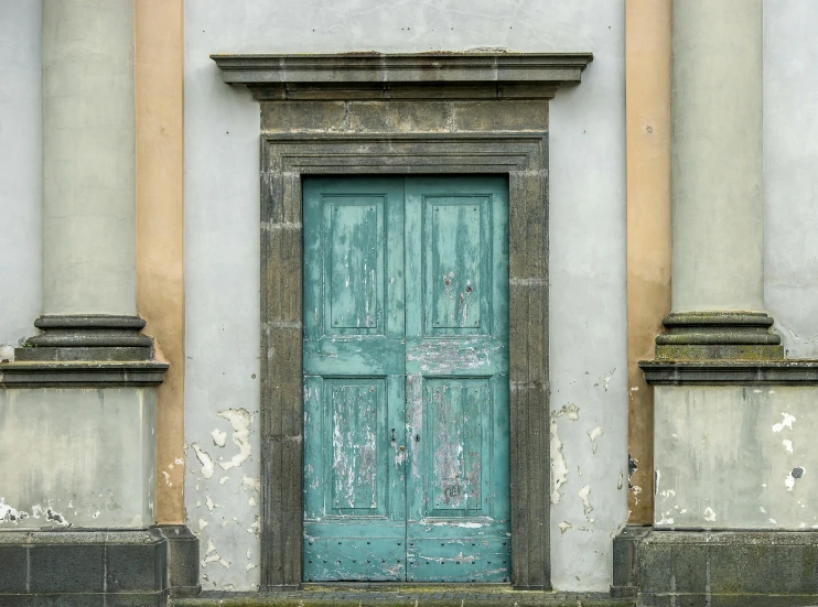 a blue door sitting on the side of a building, an album cover, by Adriaen Hanneman, pexels contest winner, neoclassicism, muted green, mold, caspar friedrich, baroque color palette