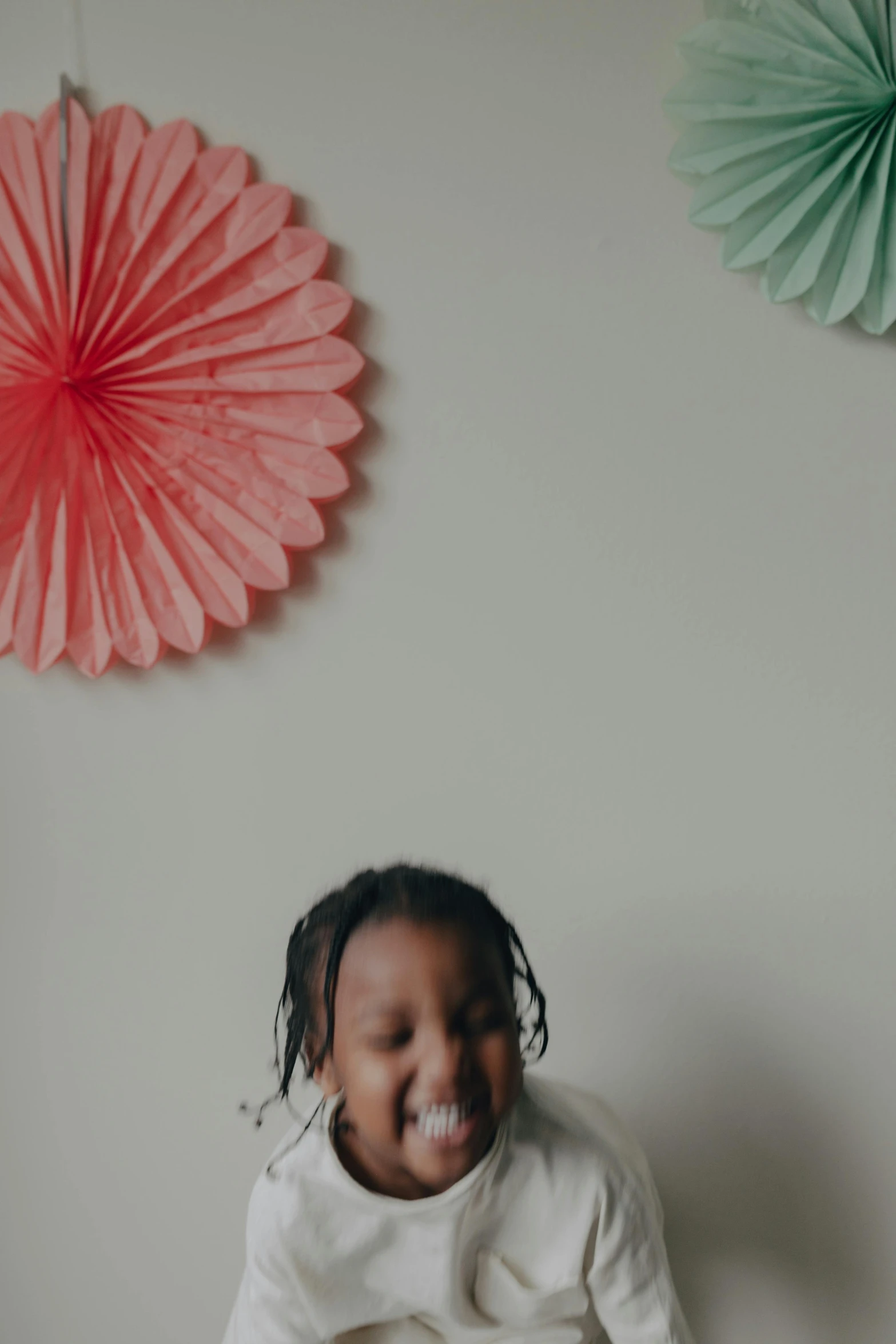 a little girl that is sitting on a bed, by Dulah Marie Evans, pexels contest winner, visual art, at a birthday party, african canadian, on grey background, fan favorite