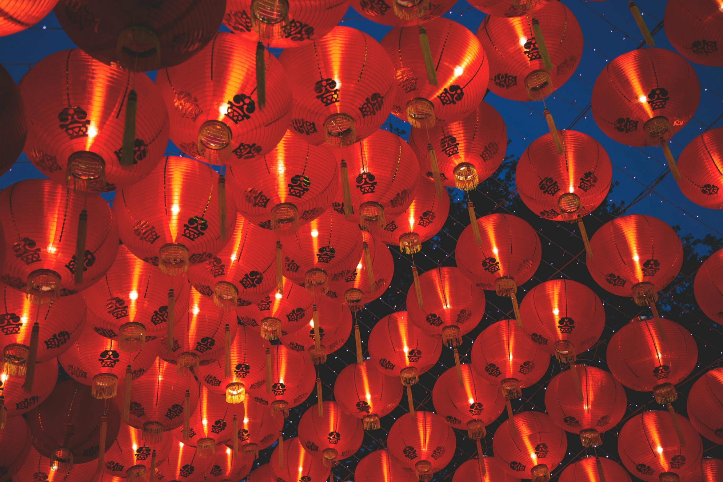 a bunch of red lanterns hanging from the ceiling, pexels, happening, square, asian sun, starry, ginger