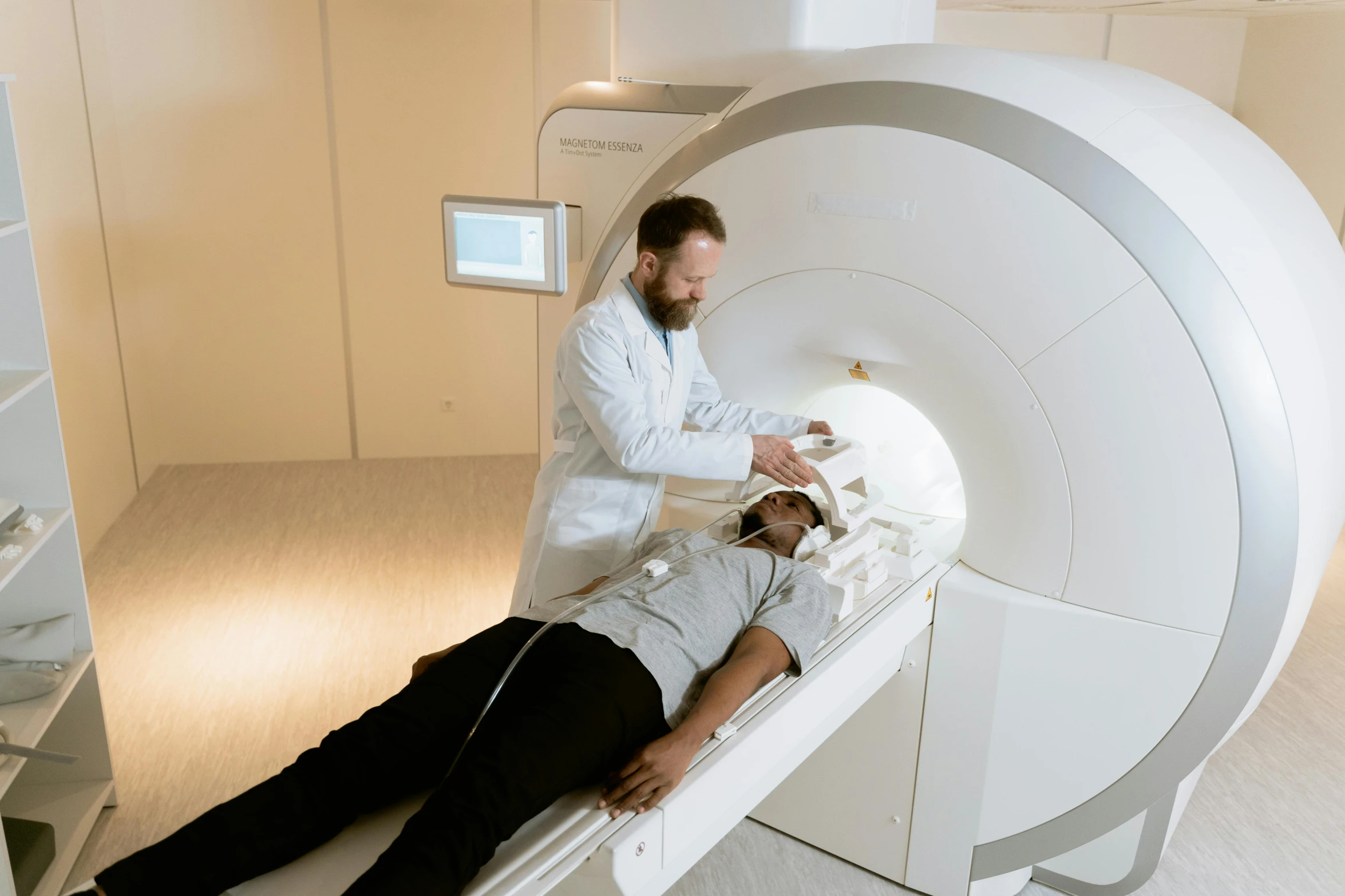 a man laying on top of a mri machine, a hologram, unsplash, crown of white lasers, discovered for the first time, high-quality photo, “ iron bark