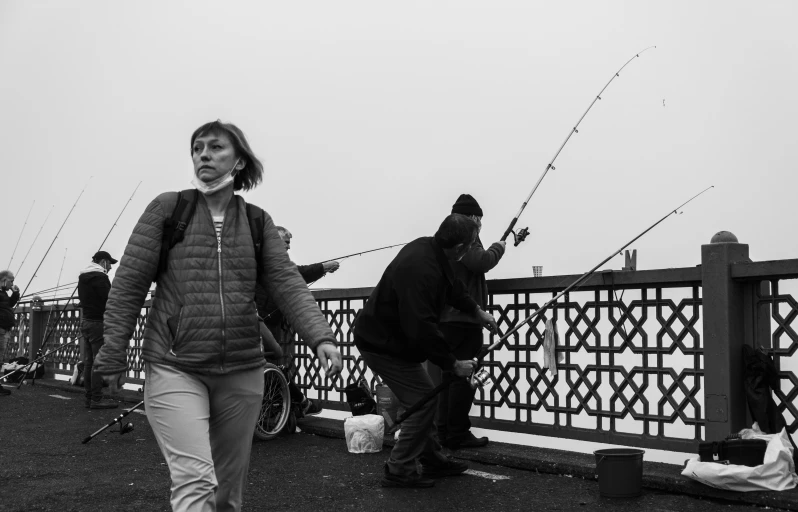 a black and white photo of people fishing, by Gusztáv Kelety, pexels, on a birdge, angelina stroganova, misty, ilya golitsyn