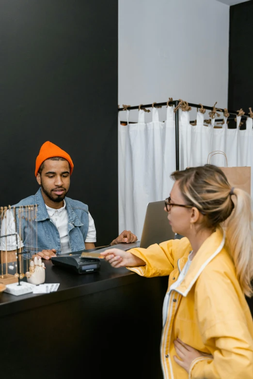 a man and a woman standing in front of a counter, trending on pexels, smart textiles, square, - 9, healthcare