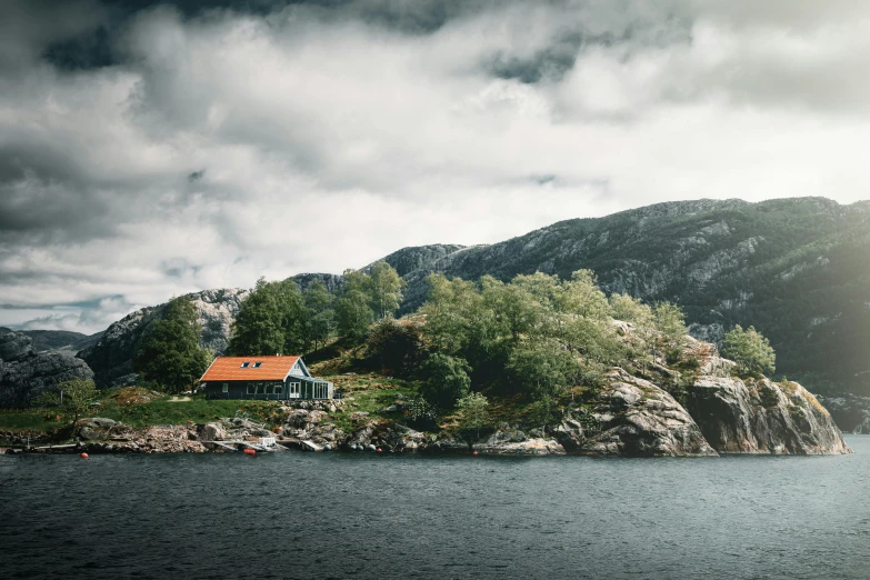 a house sitting on top of a mountain next to a body of water, by Jesper Knudsen, pexels contest winner, modernism, cottage, on an island, 2000s photo, thumbnail