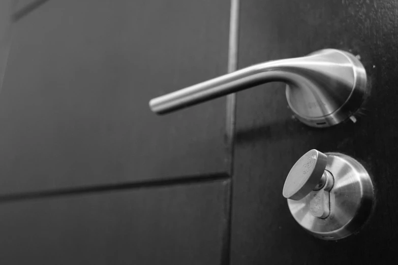 a black and white photo of a door handle, pexels, stainless steal, keys, profile picture 1024px, leaking