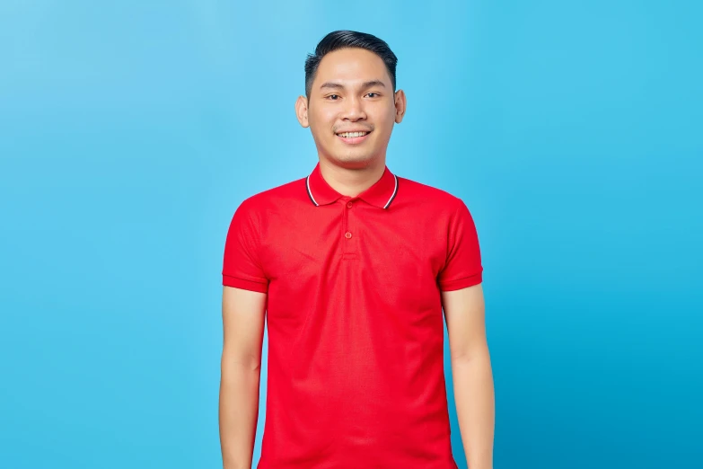 a man in a red shirt posing for a picture, a cartoon, inspired by Eddie Mendoza, pexels contest winner, wearing polo shirt, solid background, ja mong, blue or red