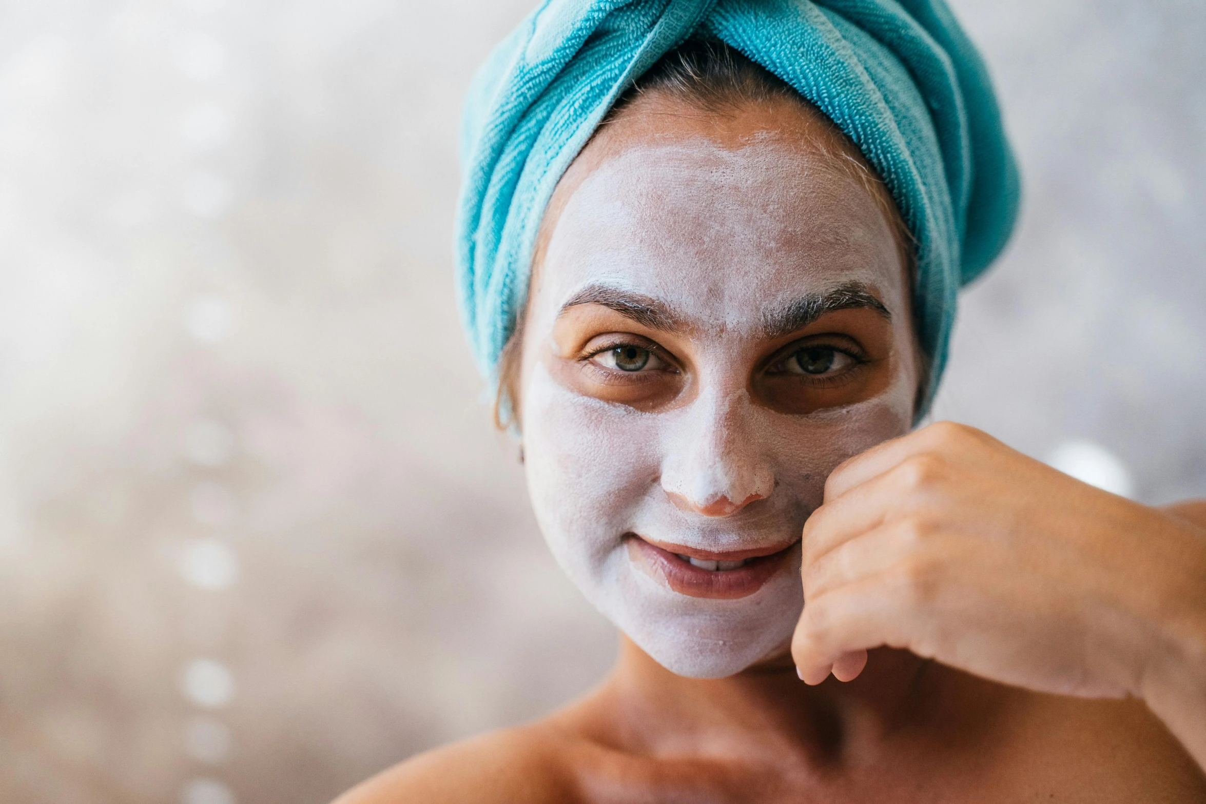 a woman with a towel wrapped around her head, trending on pexels, white face paint, manuka, silicone skin, highly relaxed