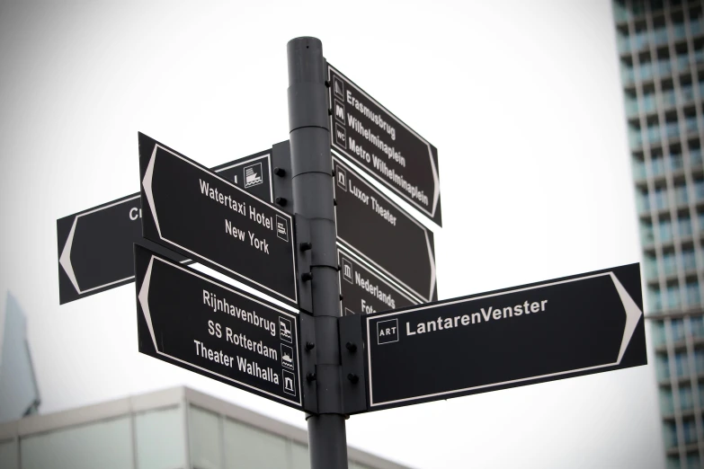 a pole with a bunch of street signs on it, by Andries Stock, square, high quality upload, innovation, netherlands