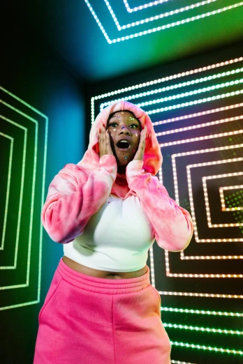 a woman in a pink outfit talking on a cell phone, rave inspired, in a hoodie, maze, promo photo
