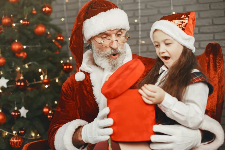 a little girl sitting in a chair next to a santa clause, pexels, avatar image, ladies, high resolution, an oldman