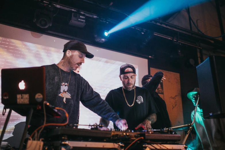 a couple of men standing next to each other on a stage, unsplash, purism, turntablism dj scratching, mac miller, as well as scratches, boiler room