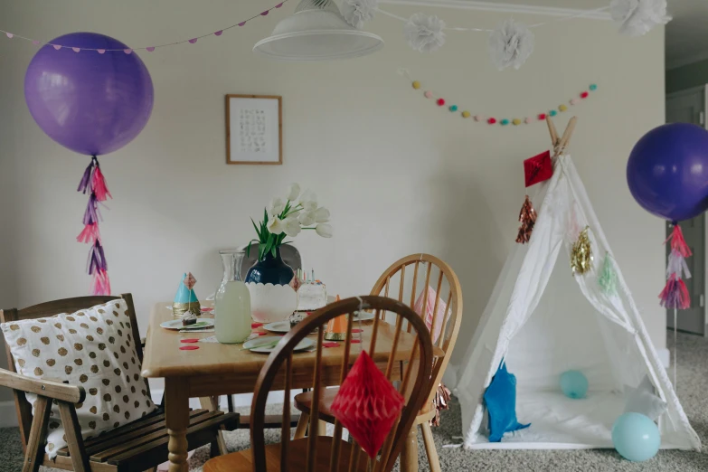 a birthday party with a teepee tent and balloons, pexels contest winner, process art, dining room, cosy vibes, very hazy, free spaces