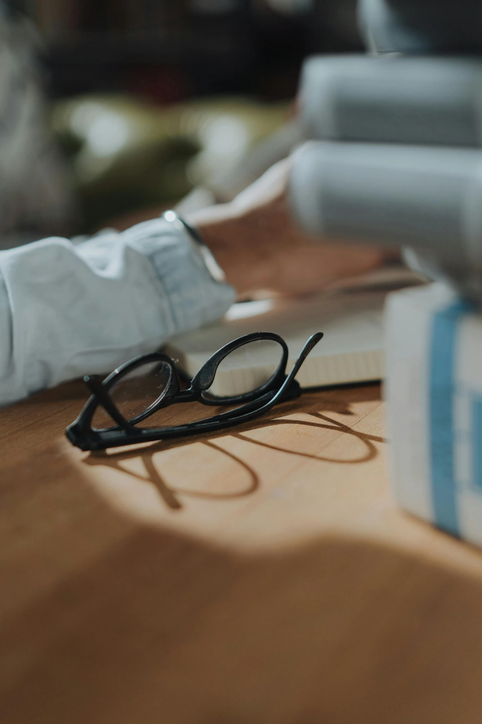 a close up of a person typing on a laptop, by Sebastian Vrancx, pexels contest winner, private press, square glasses, holding books, surgical supplies, detailed cinematic render