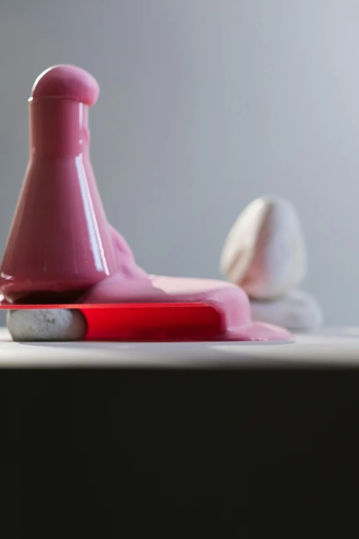 a pair of scissors sitting on top of a table, an abstract sculpture, by Doug Ohlson, massurrealism, toothpaste blast, pink light, singularity sculpted �ー etsy, love scene