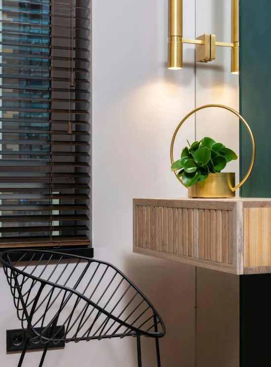 a chair sitting next to a window in a room, lacquered oak reception desk, modern lush condo as shopfront, black and gold wires, profile image