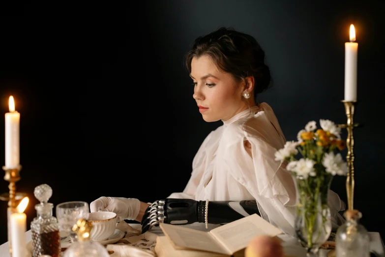 a woman sitting at a table reading a book, a portrait, inspired by Hedda Sterne, pexels contest winner, neo-romanticism, cinematic outfit photo, dinner is served, white sleeves, 1 9 1 0 s style