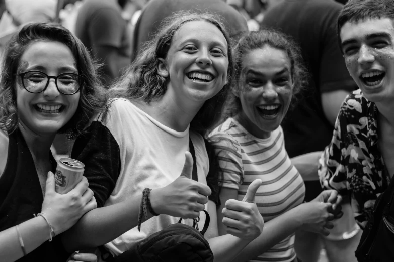 a black and white photo of a group of people, by Adam Marczyński, pexels contest winner, happy girl, thumb up, 15081959 21121991 01012000 4k, concert