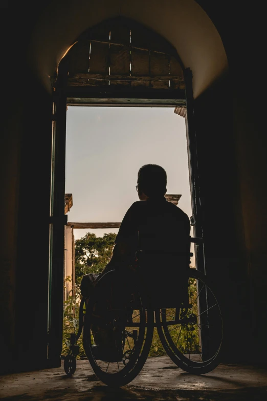 a person in a wheel chair in a doorway, pexels contest winner, gazing off into the horizon, summer evening, ( ( theatrical ) ), balcony