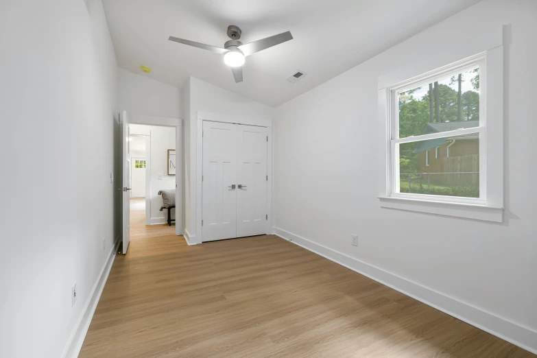 a room with wood floors and a ceiling fan, by Carey Morris, featured on reddit, light and space, modern minimalist f 2 0 clean, high details photo, no two rooms are identical. 4k, album