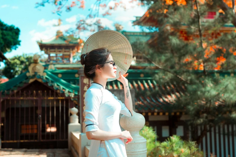 a woman wearing a white dress and a hat, inspired by Gu An, pexels contest winner, cloisonnism, japan sightseeing, avatar image, vietnamese temple scene, (good looking )