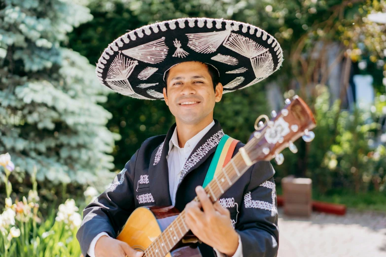 a man wearing a sombren and holding a guitar, inspired by Germán Londoño, sombrero, corporate photo, wearing traditional garb, thumbnail