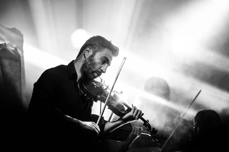a black and white photo of a man playing a violin, by Mathias Kollros, pexels contest winner, live concert, avatar image, handsome man, reza afshar