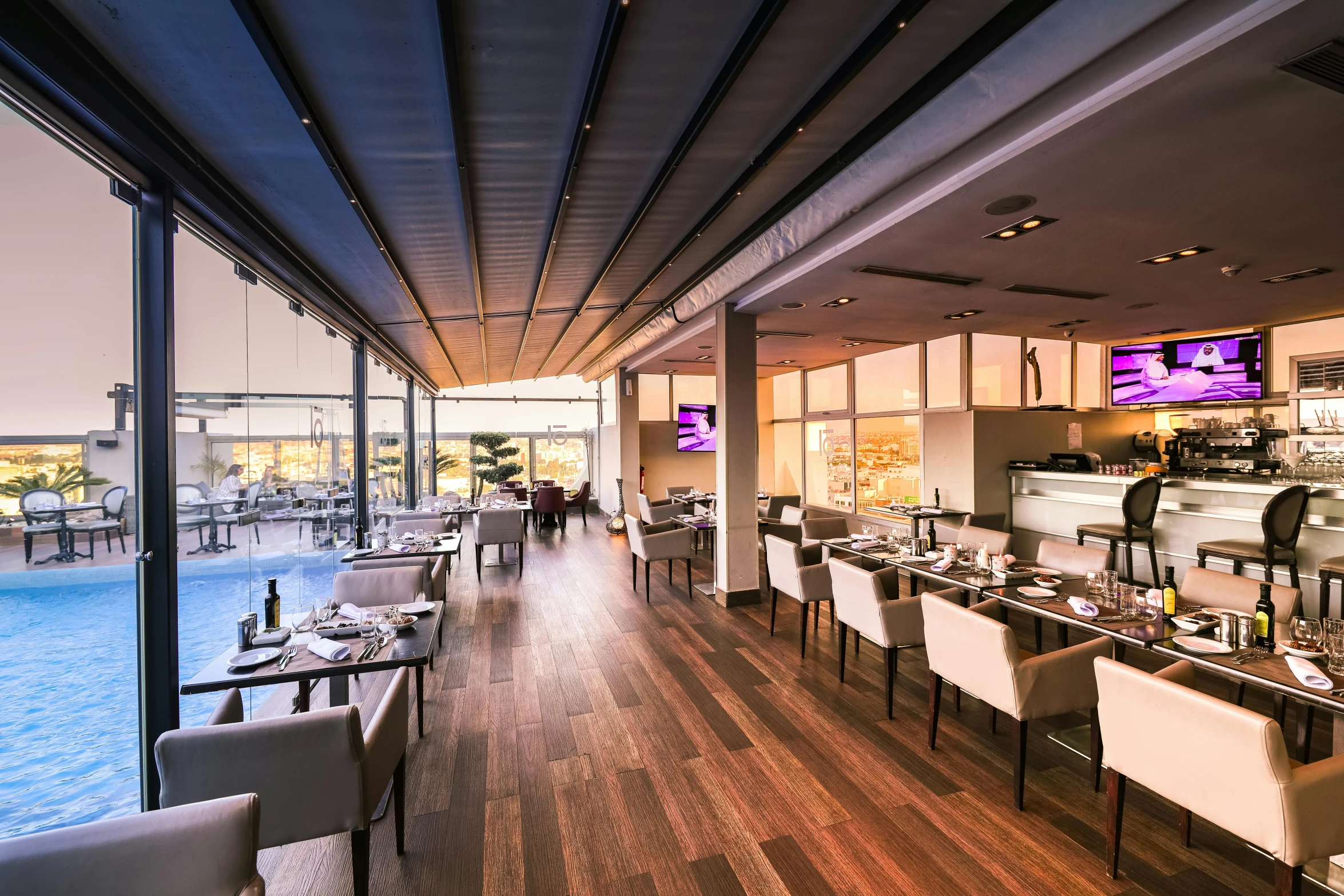 a dining room filled with lots of tables and chairs, by Daniel Gelon, unsplash, happening, purple accent lighting, at the terrace, future miramar, thumbnail