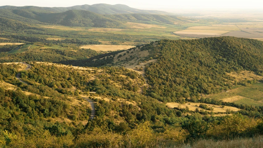 a man riding a horse on top of a lush green hillside, inspired by Jenő Gyárfás, pexels contest winner, les nabis, panorama distant view, israel, late summer evening, vallejo