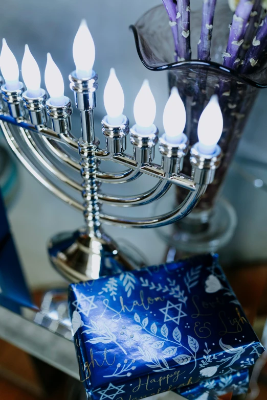 a bunch of candles that are on a table, blue and silver, hebrew, fan favorite, detail shot