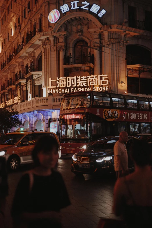 a city street filled with lots of traffic next to tall buildings, inspired by Shi Zhonggui, trending on unsplash, art nouveau, people at night, shop front, baotou china, bright signage