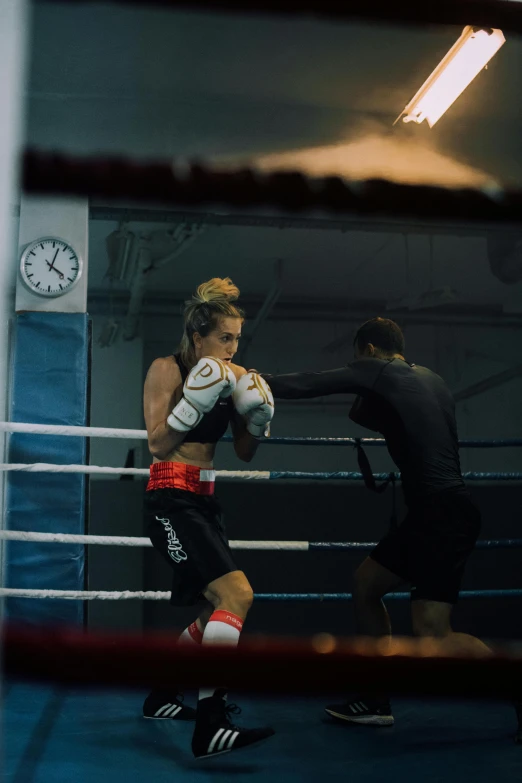 a couple of men standing next to each other in a boxing ring, by Lee Gatch, pexels contest winner, happening, female model, vfx action shot, manuka, jamie campbell bower