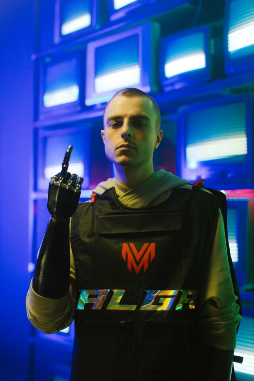 a man in a costume standing in front of a wall, an album cover, inspired by Elsa Bleda, futurism, tactical vests and holsters, mac miller, ( ( ( alien ) ) ), made of lasers