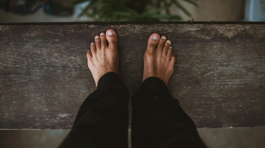 a person standing on top of a wooden bench, by Niko Henrichon, pexels contest winner, renaissance, exposed toes, background image, barefoot, portrait of tall