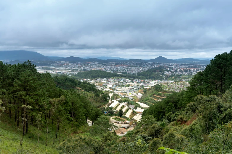 a view of a city from the top of a hill, vietnam, in avila pinewood, gray, gigapixel photo