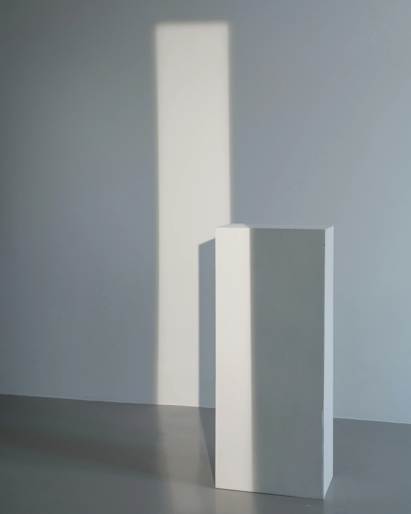 a couple of tall white pedestals in a room, inspired by Donald Judd, unsplash, light and space, modeled lighting, sun beam, ignant, angle view