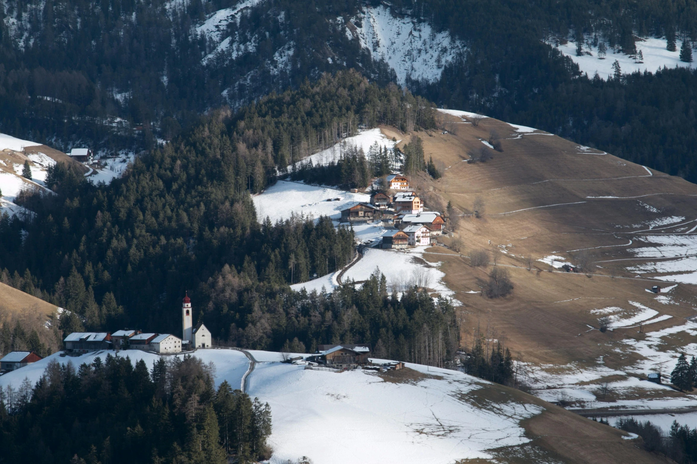 a group of people riding skis on top of a snow covered slope, by Carlo Martini, pexels contest winner, renaissance, view of villages, taken from a plane, john pawson, churches