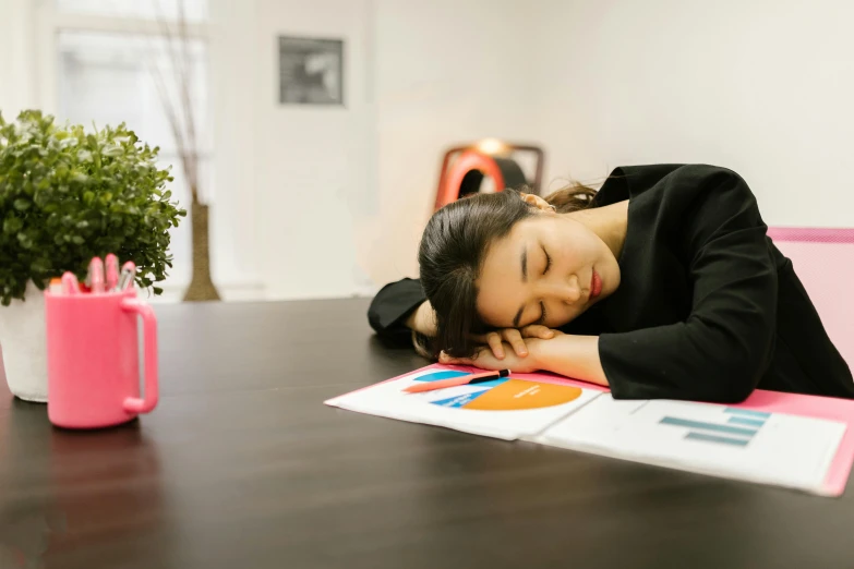 a woman sleeping on a desk in an office, by Julia Pishtar, pexels contest winner, asian female, two exhausted, various posed, profile image