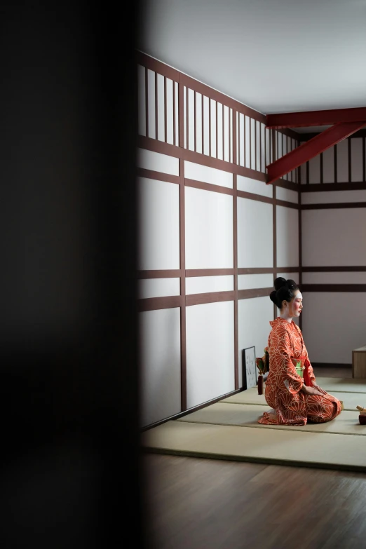 a woman sitting on the floor in a room, a picture, inspired by Sesshū Tōyō, trending on unsplash, wearing kimono armour, square, high resolution photo, slide show