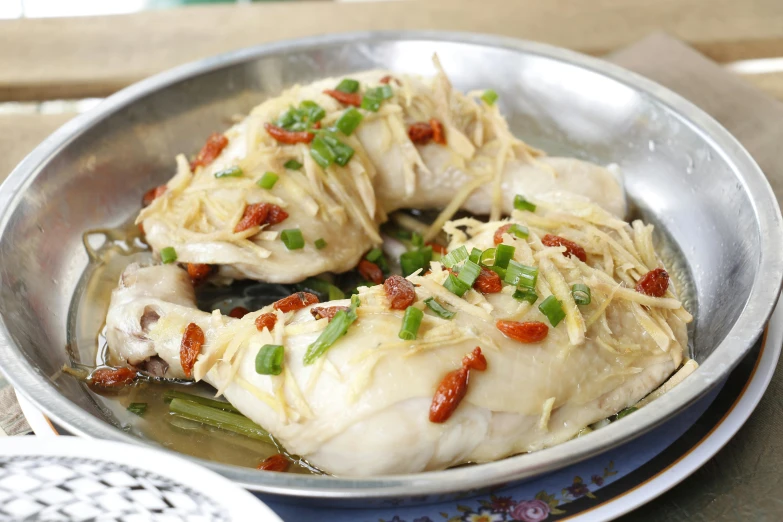 a close up of a pan of food on a table, feng zhu |, chicken, 千 葉 雄 大, stuffed