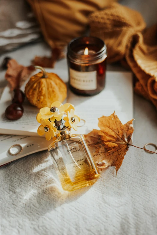 a pair of scissors sitting on top of a table, a still life, trending on pexels, floating in perfume, the goddess of autumn harvest, yellow theme, candlelit