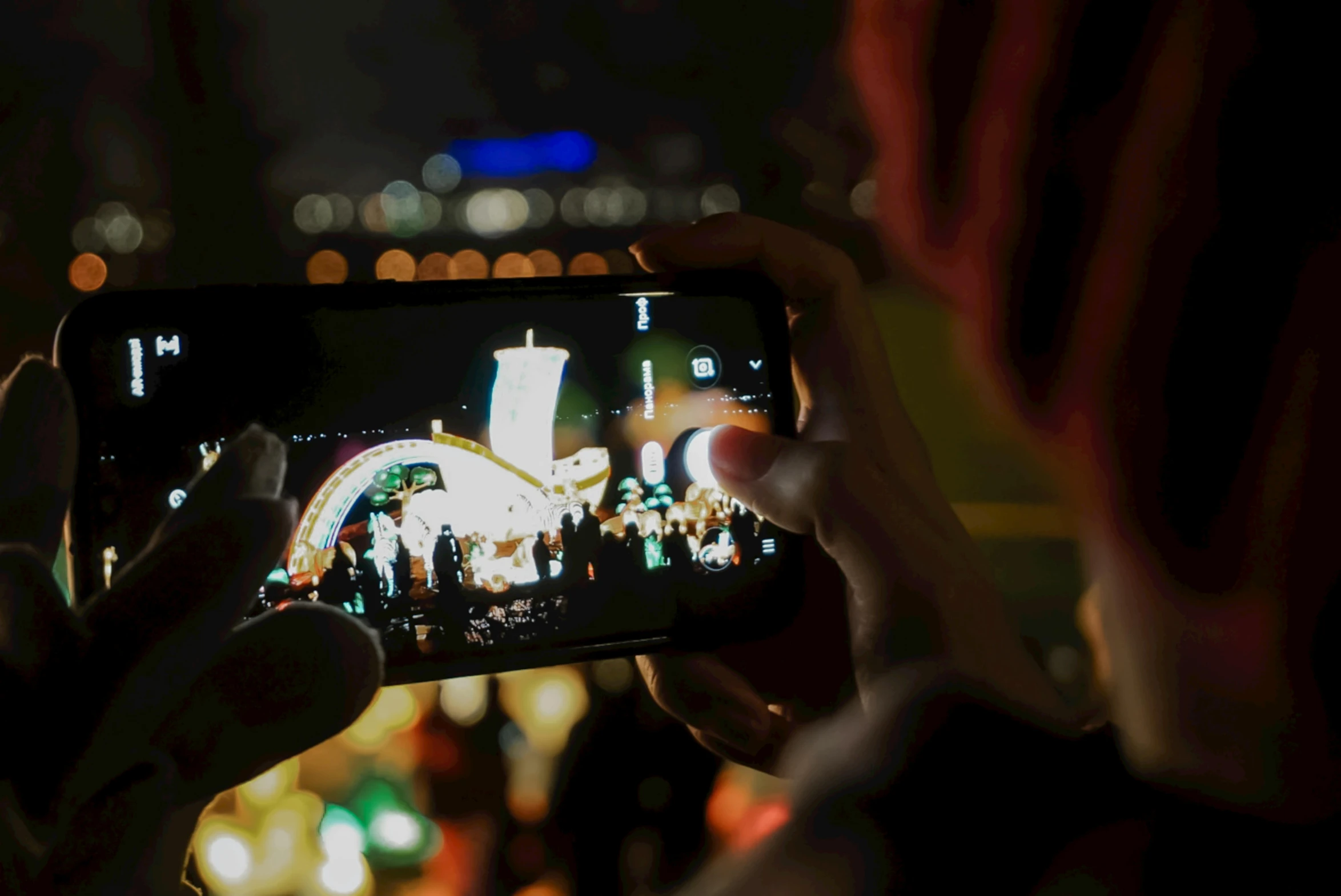 a person taking a picture of a city at night, a picture, happening, festivals, avatar image, rectangle, holiday season