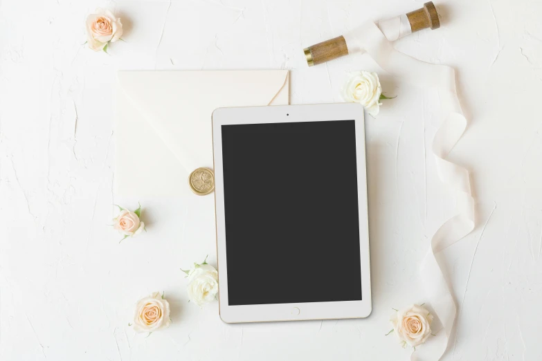 a tablet computer sitting on top of a white table, by Carey Morris, pexels, computer art, white roses, invitation card, panel of black, high quality product image”
