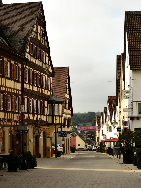a couple of buildings that are next to each other, an album cover, by Robert Richenburg, pexels contest winner, renaissance, small town surrounding, exterior view, speilberg movie, taken in the late 2010s