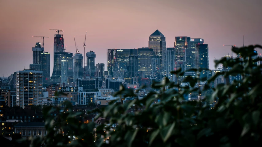 a view of a city from the top of a hill, by Joseph Severn, unsplash contest winner, canary wharf, early evening, low detail, viewed from a distance