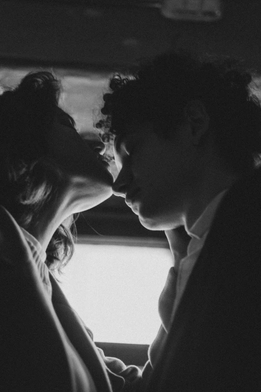 a black and white photo of a man kissing a woman, a black and white photo, by Alexis Grimou, tumblr, romanticism, joe keery, robert sheehan, in style of petra collins, profile image