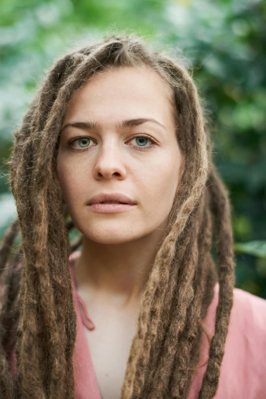 a woman with dreadlocks posing for a picture, an album cover, inspired by Louisa Matthíasdóttir, unsplash, antipodeans, actress, mixed race, max dennison, similar to legolas