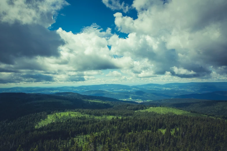 a view of the mountains from the top of a mountain, pexels contest winner, baroque, black forest, cumulus, forest green, high quality image”