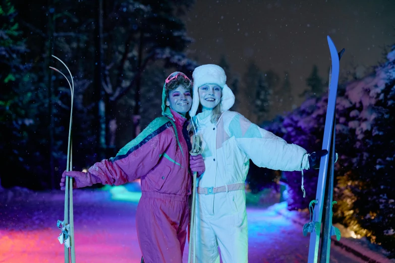 a couple of women standing next to each other holding skis, by Julia Pishtar, happening, wonderland at night, espoo, screensaver, skintight suits
