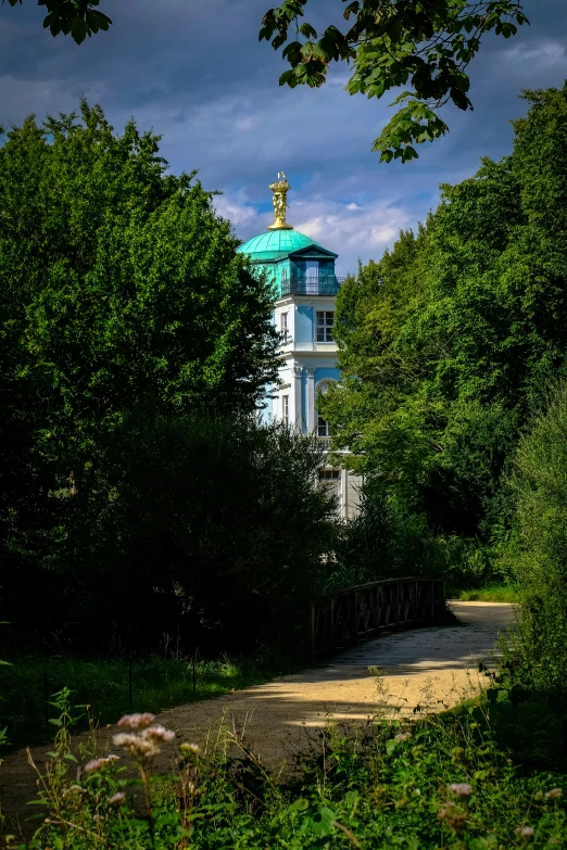a clock tower sitting in the middle of a lush green forest, by Harry Haenigsen, baroque, turquoise gold details, berlin, orthodox, light house